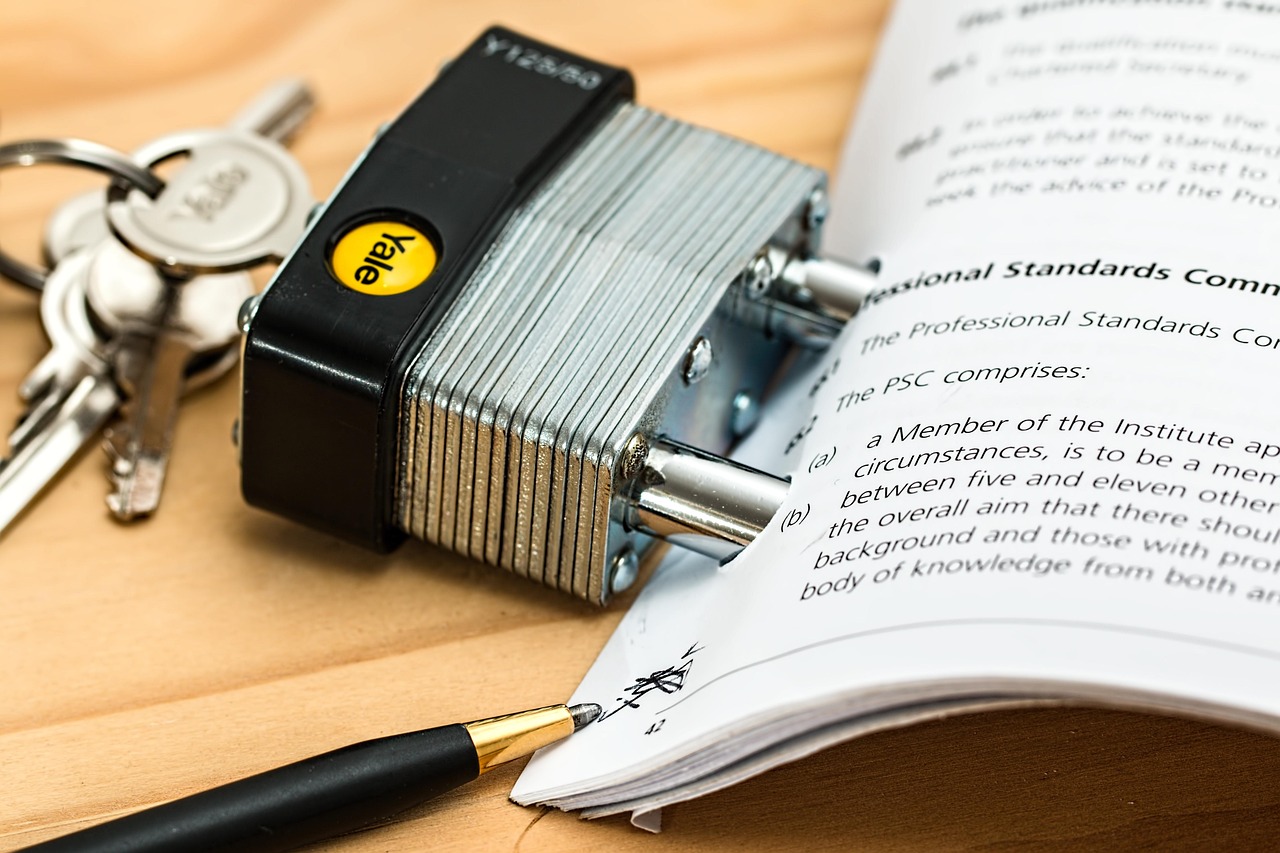 House keys resting on a stack of mortgage paperwork.