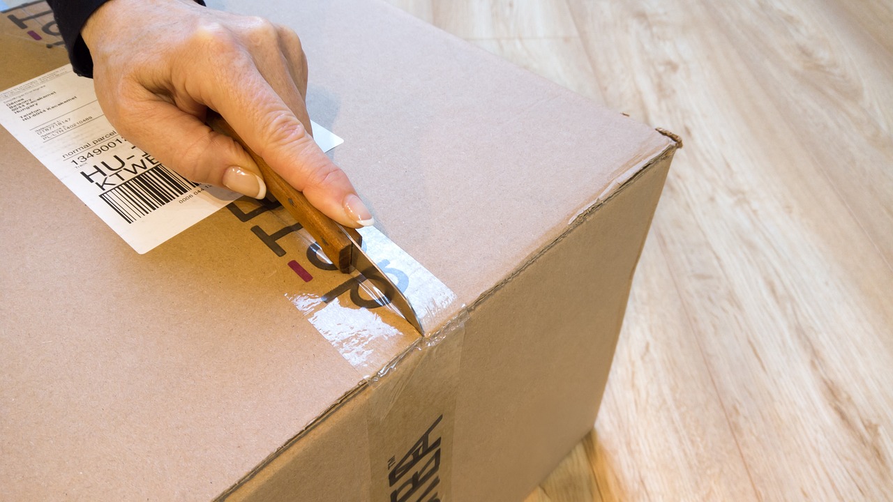 Cardboard boxes packed at an office desk during a job change.