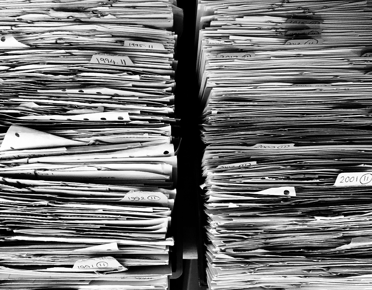 A labeled file folder holding letters and receipts.