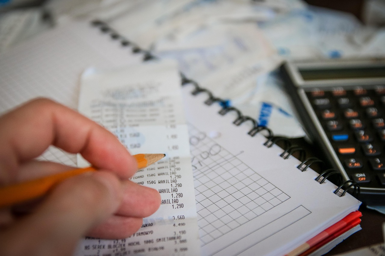 A person checking a savings account balance on a laptop at home.
