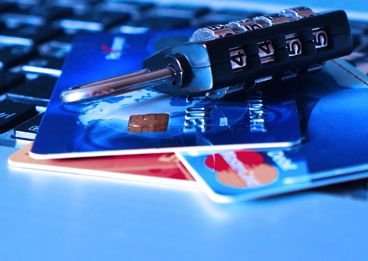 A person shredding documents that contain personal information.
